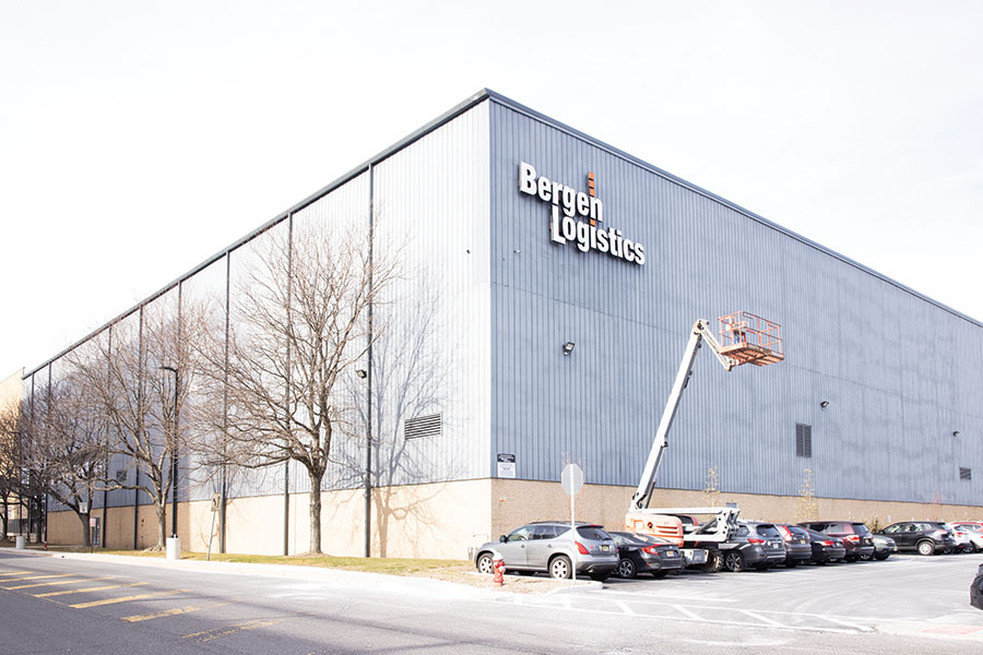 Exterior view of Bergen Logistics warehouse headquarters with company logo, showcasing 3PL facilities and operations.