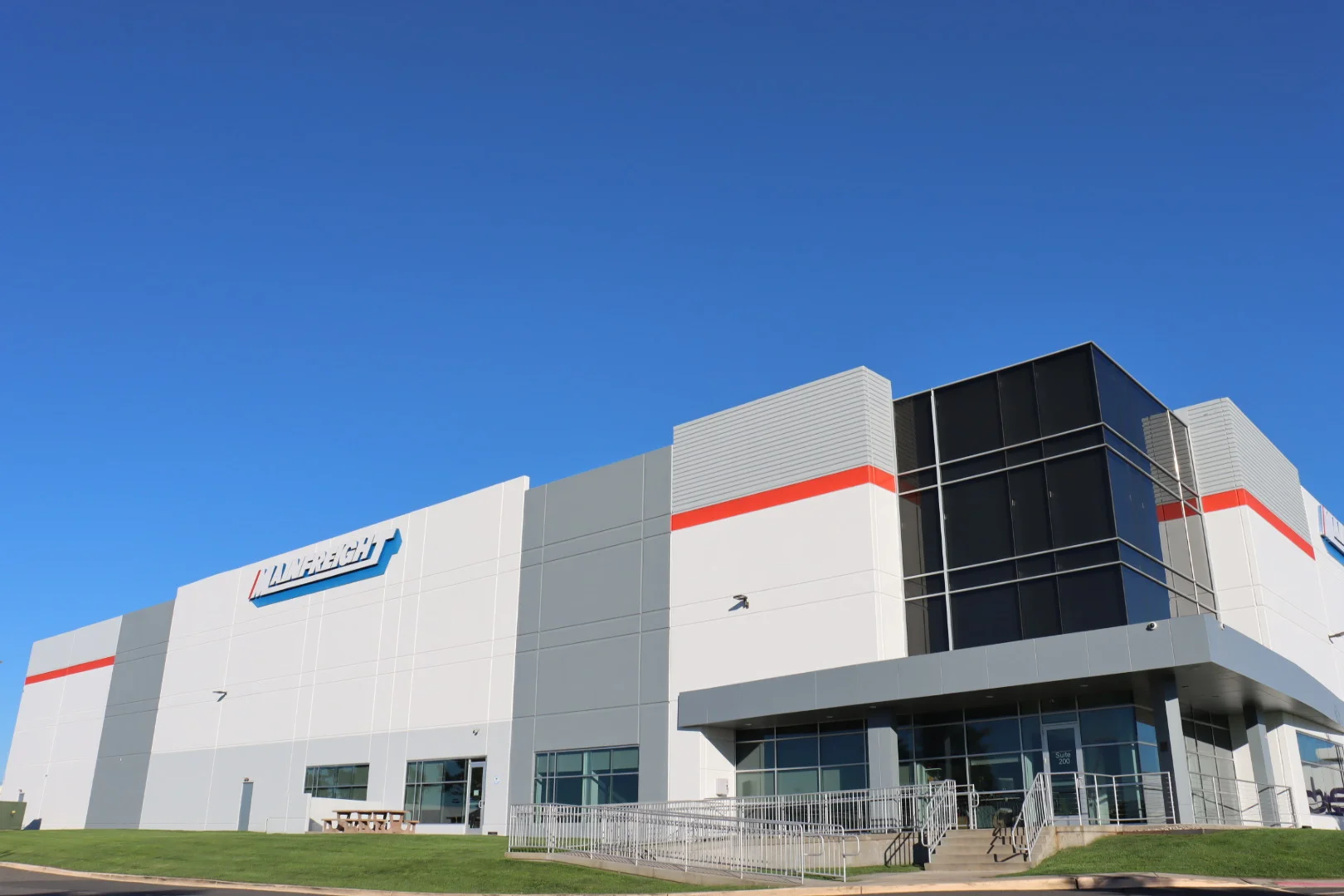 Mainfreight warehouse and headquarters with modern architectural design, located in Newark, featured in Fulfill.com's article on Mainfreight's logistics and 3PL services.