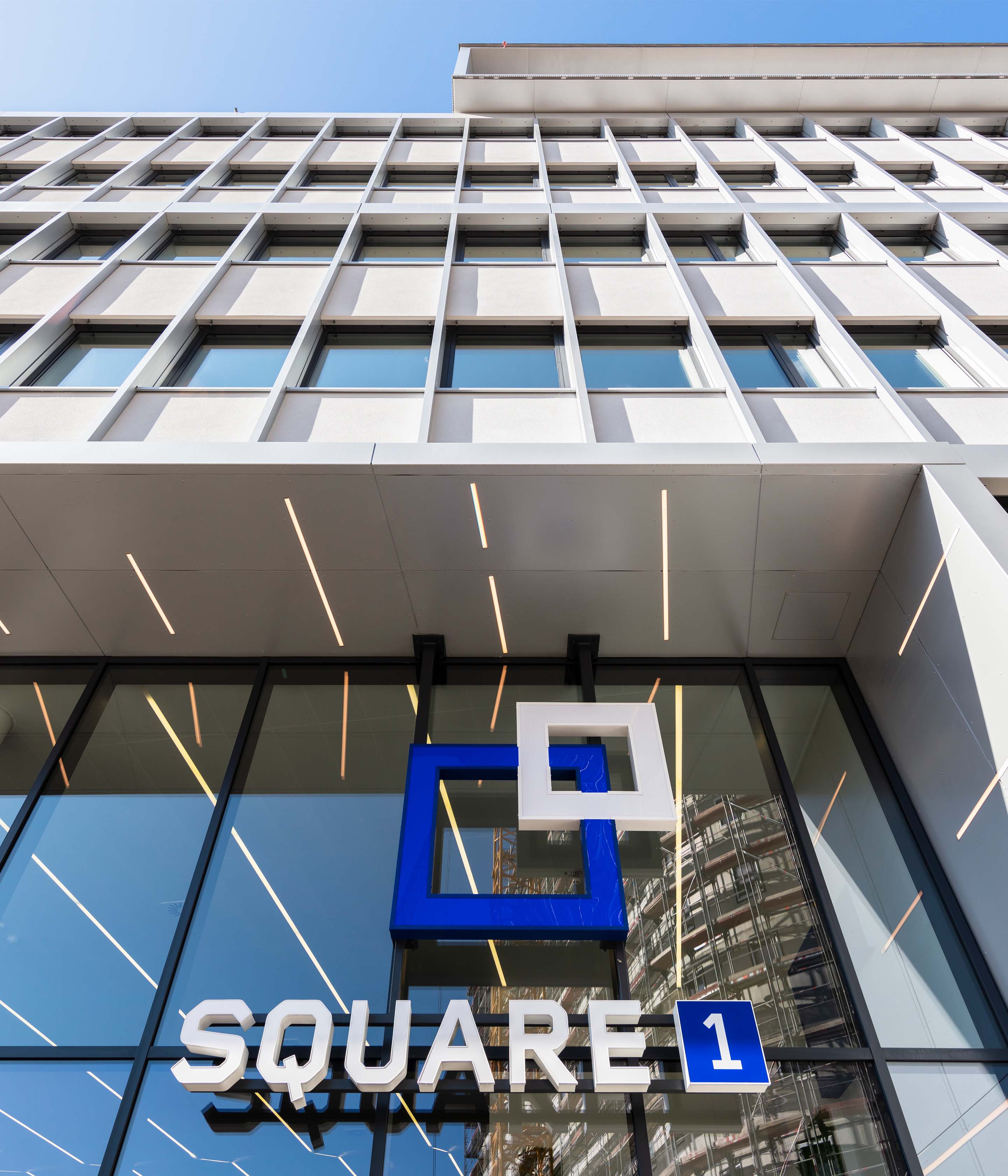 Exterior view of Square1 headquarters building, showcasing modern architectural design with the company's logo prominently displayed. Featured in Fulfill.com's article on Square1's warehouse locations.