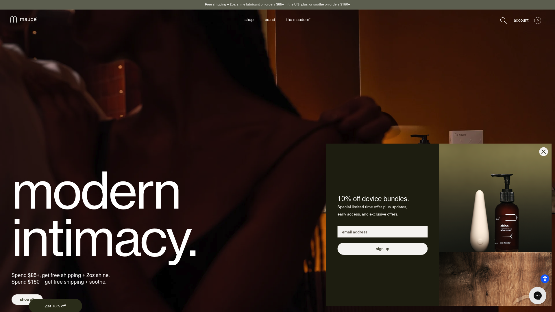 A screenshot of Maude's homepage showing the brand's minimalist and playful aesthetic. The Maude logo is prominently displayed, composed of warm neutral colors that convey a sense of calm and intimacy. Below the logo, a clean layout features categories like "sex," "supplements," "skin," "devices," "lubricants," "condoms," "candles & massage," "soaks & bubble bath," showcasing a range of personal care products. Hero images highlight ultra-thin latex condoms, organic personal lubricants, and soy-based massage candles in various sizes, emphasizing luxury and quality. The homepage highlights the "Rise + Shine" bundle, incorporating ultra-thin condoms and aloe-based lubricant, alongside user ratings and quick view options. This modern, gender-neutral design targets adults seeking sophisticated intimacy products. By leveraging strategic collaborations and notable features, Maude positions itself as a chic, modern brand in the personal wellness industry, blending design with intimacy to resonate with a discerning audience.