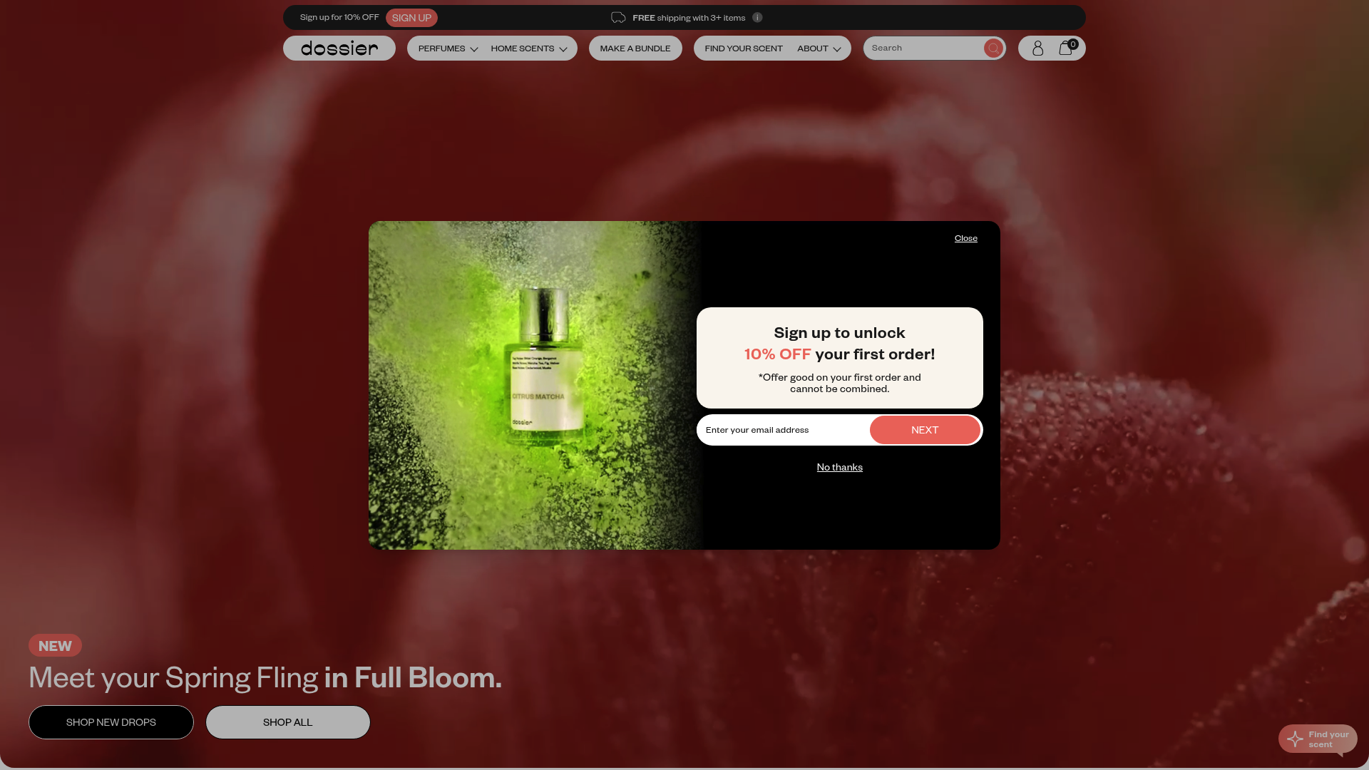 A screenshot of Dossier Perfumes's homepage showing a clean and elegant layout. The logo, "Dossier," is prominently displayed, reflecting a minimalist and sophisticated branding. The hero image features luxury perfumes with a tagline, "Discover luxury scents," highlighting designer-inspired and in-house fragrances at affordable prices. The color scheme is neutral, with subtle splashes of color, emphasizing a modern and approachable luxury.  The homepage showcases various product ranges, including Dossier Impressions and Originals. Products are categorized by gender and collections such as Genderless, Seasons, Icons, and include offerings like gift sets and home scents (candles and room diffusers). Highlighted features include perfumes "inspired by" popular luxury fragrances, suggesting accessibility to high-end scents.  Overall, the design targets fashion-conscious individuals seeking luxury at a fair price, conveying a brand personality of accessible elegance and quality. Keywords: luxury perfumes, designer-inspired fragrances, accessible luxury, home scents, gift sets.