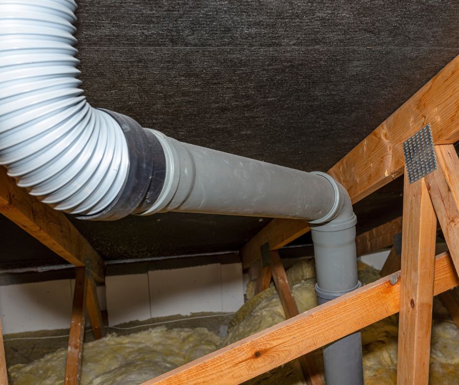 Bathroom fan venting warm air into an attic.