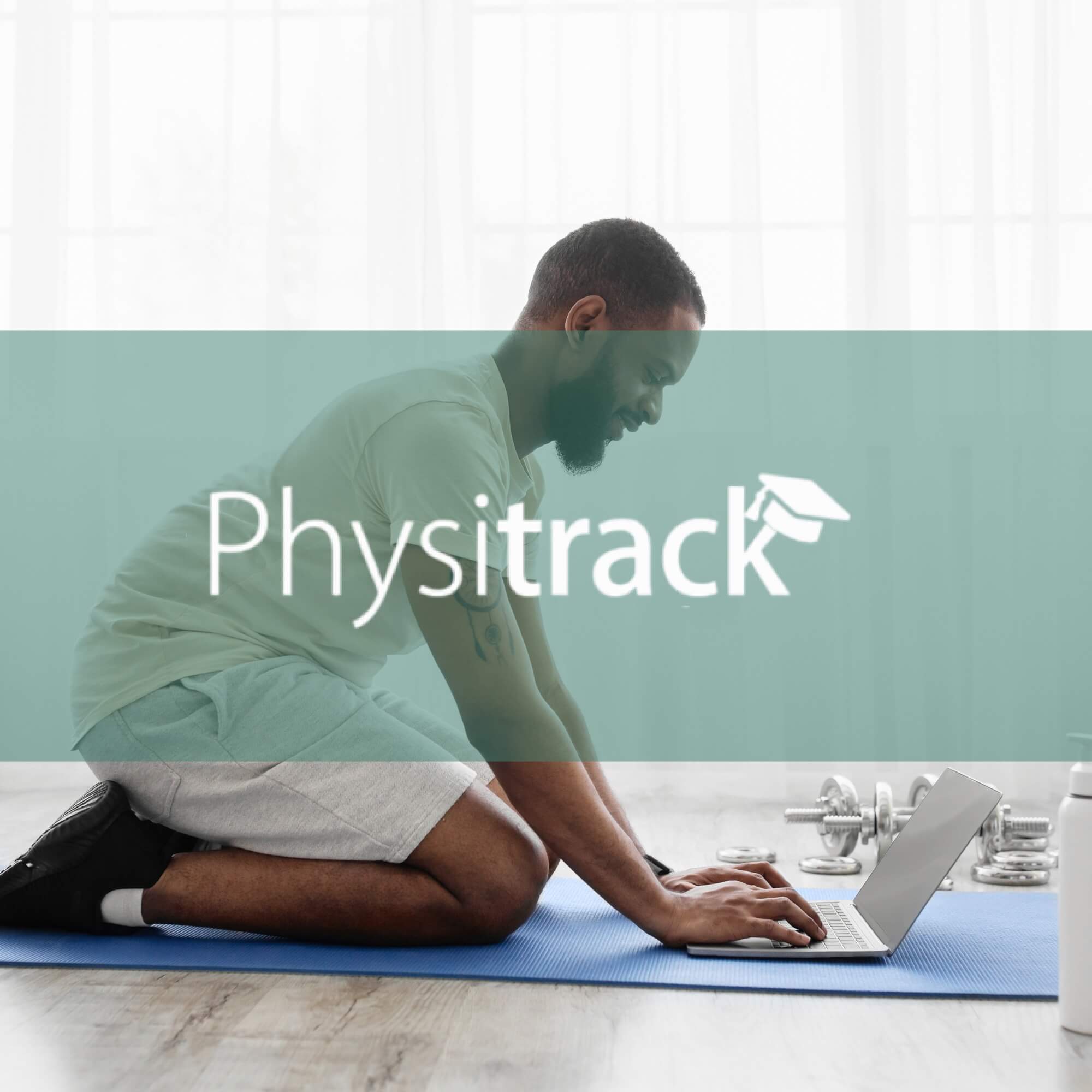 Man kneeling on a yoga mat using a laptop beside dumbbells, with the Physitrack wordmark overlaid.