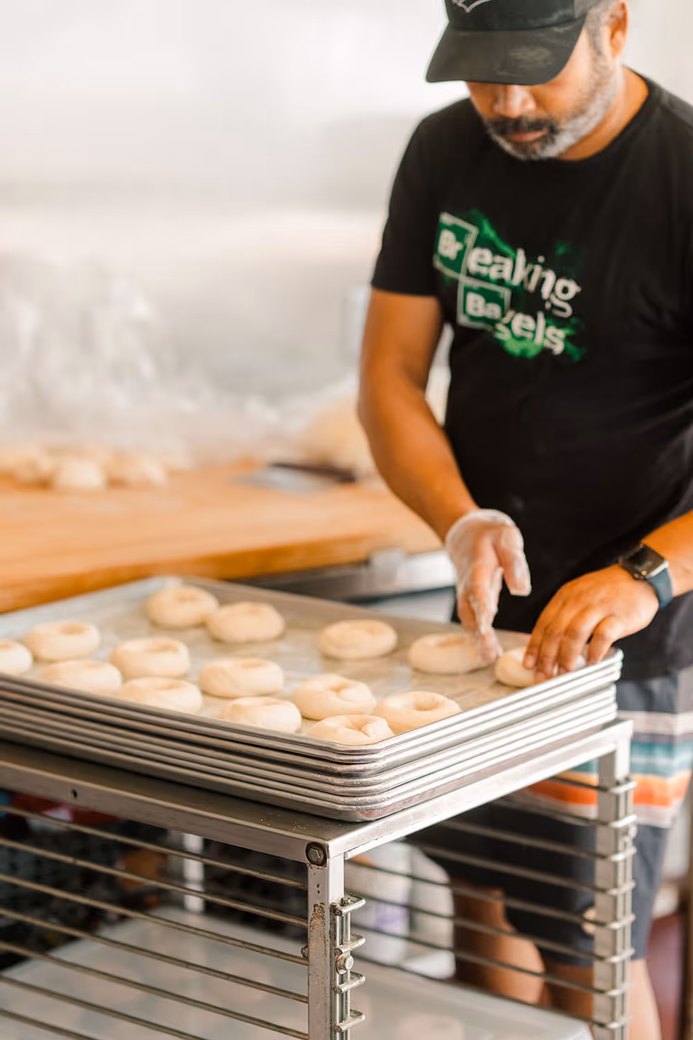 A baker making bagels