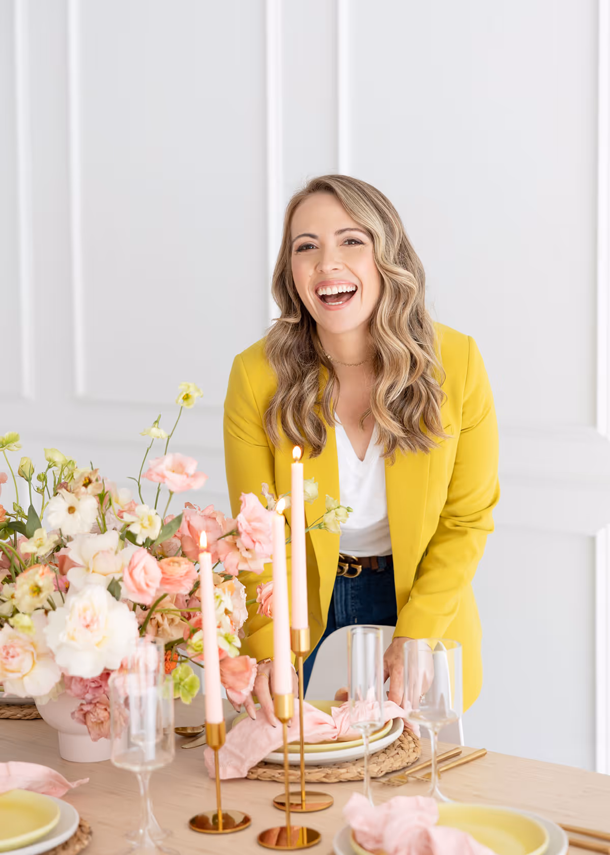 A wedding planner working on her marketing strategy at her laptop. Photo credit Bloom and Flourish Studio