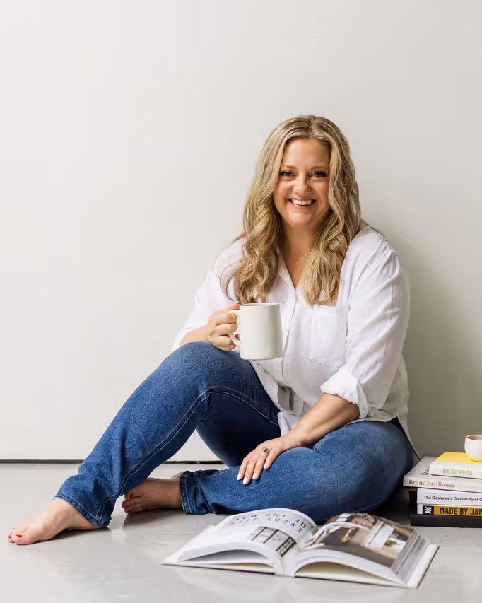 A wedding planner working on her marketing strategy at her laptop. Photo credit Bloom and Flourish Studio