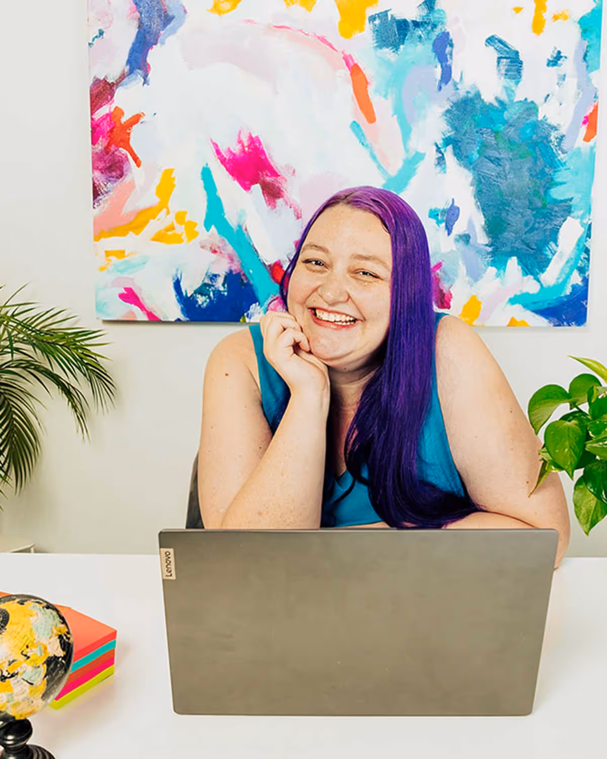 A wedding planner working on her marketing strategy at her laptop. Photo credit Bloom and Flourish Studio