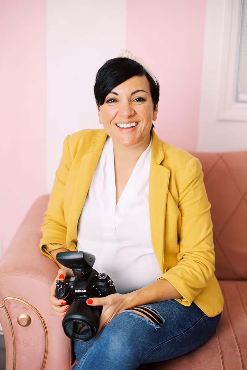A wedding planner working on her marketing strategy at her laptop. Photo credit Bloom and Flourish Studio