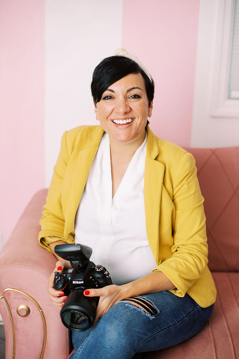 A wedding planner working on her marketing strategy at her laptop. Photo credit Bloom and Flourish Studio