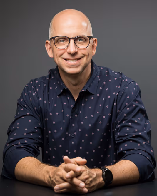 A wedding planner working on her marketing strategy at her laptop. Photo credit Bloom and Flourish Studio