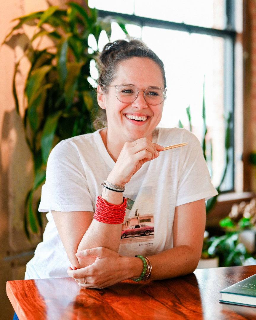 A woman sitting at a desk.