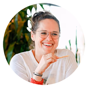 Headshot of a woman holding a pencil