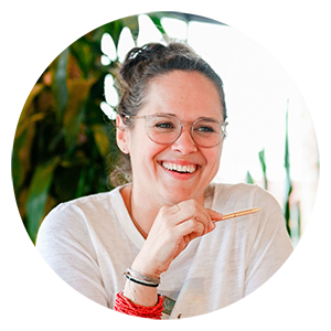 Headshot of a woman holding a pencil