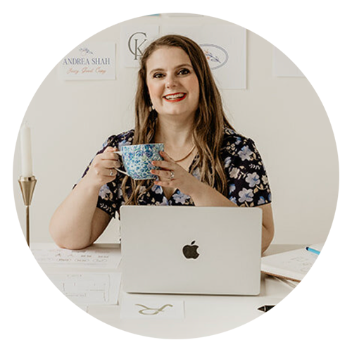 Headshot of a woman sitting at a desk with a laptop