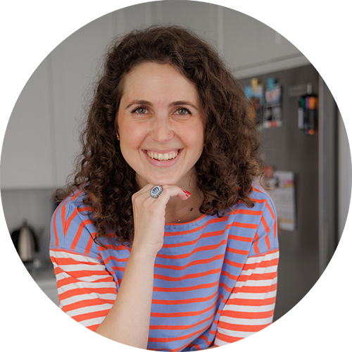 Headshot of a woman in a striped shirt