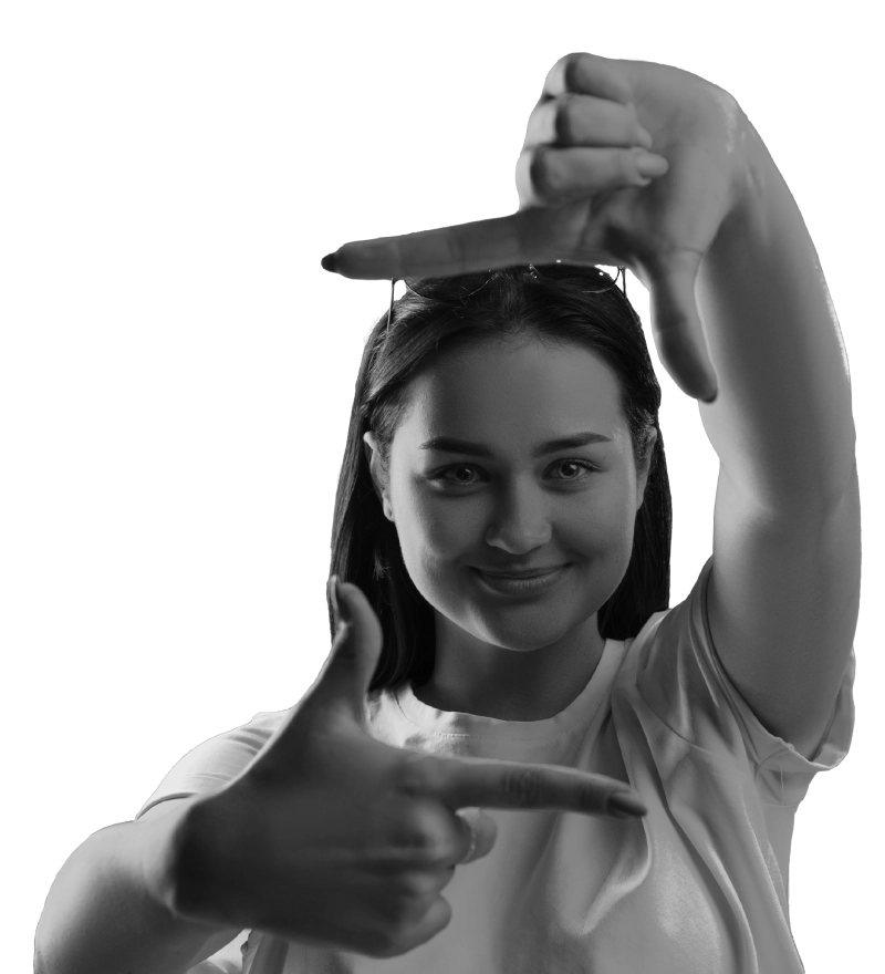 Smiling woman making a frame gesture with her hands, representing Bolt PR's focus on creative brand positioning and digital marketing perspective.