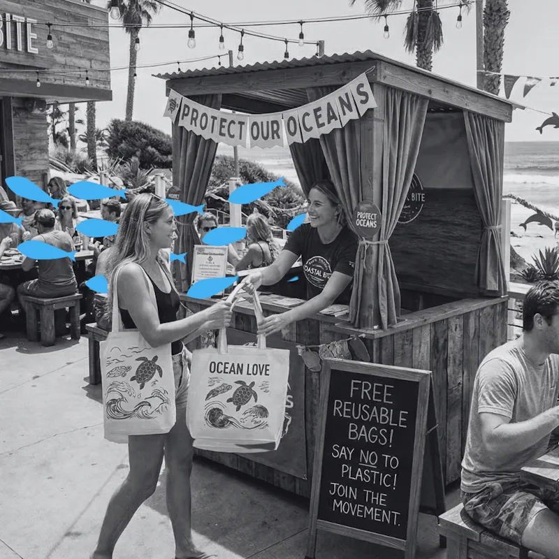 Staff handing out reusable ocean conservation bags at an outdoor promotional booth, demonstrating a fast-casual restaurant PR campaign solution