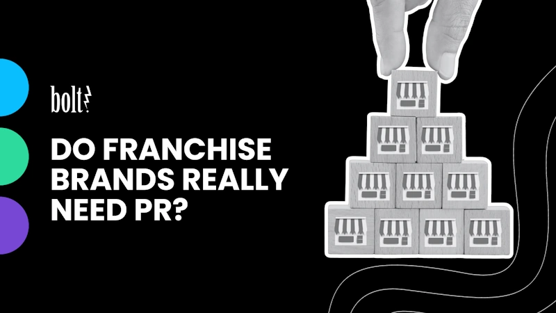 Title graphic reading Do Franchise Brands Really Need PR by Bolt PR, featuring a hand stacking storefront blocks to represent franchise growth.