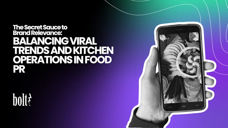 Title graphic reading The Secret Sauce to Brand Relevance: Balancing Viral Trends and Kitchen Operations in Food PR by Bolt PR, featuring a hand holding a smartphone that displays a viral food platter.