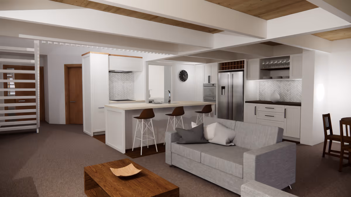 Modern open-plan living room and kitchen with gray sofa, wooden coffee table, kitchen island with stools, and stainless steel appliances.