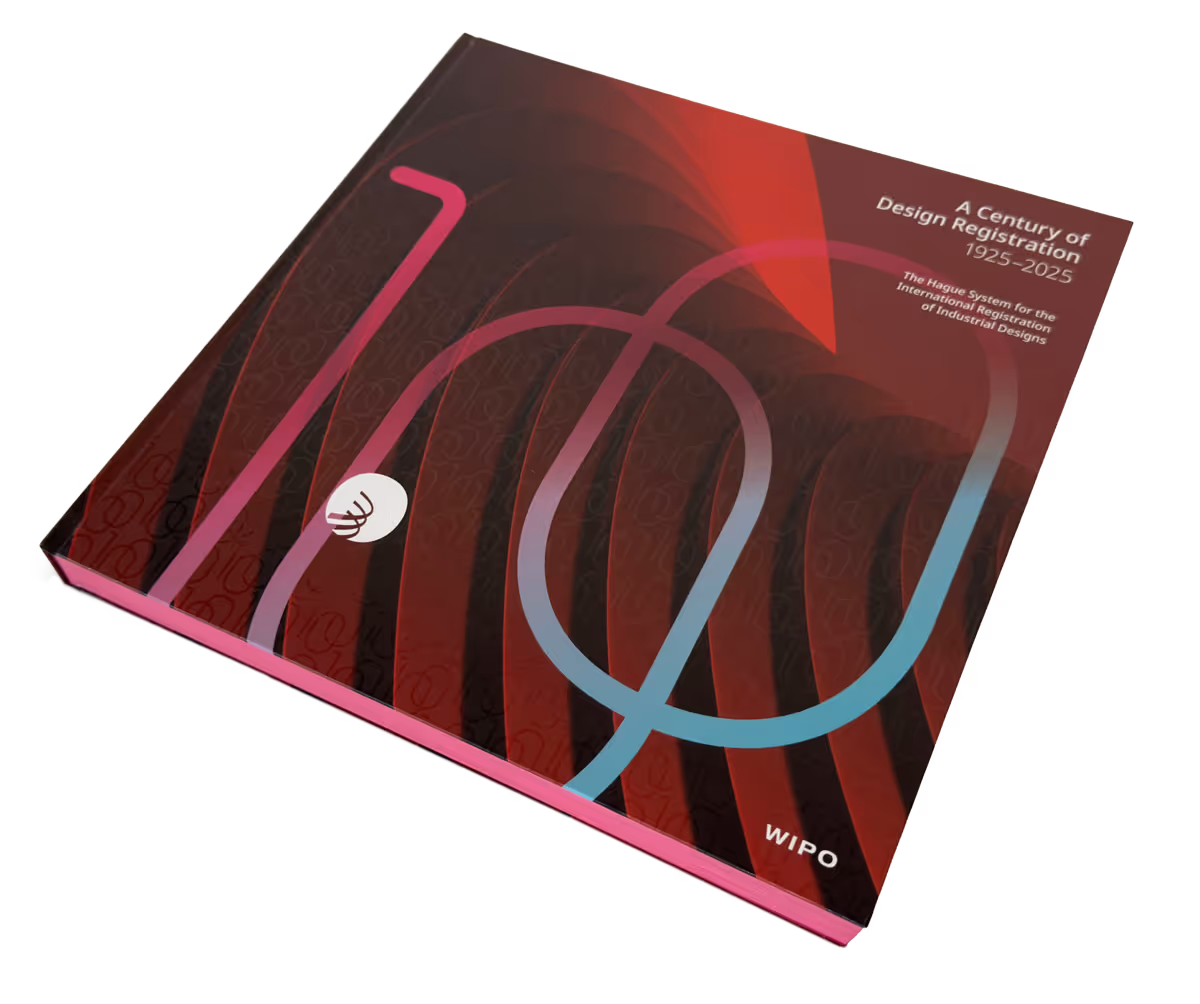 Hardcover book titled 'A Century of Design Registration 1925–2025' with red, black, and gradient pink-blue abstract design, published by WIPO.