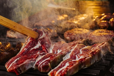 steaks on a grill