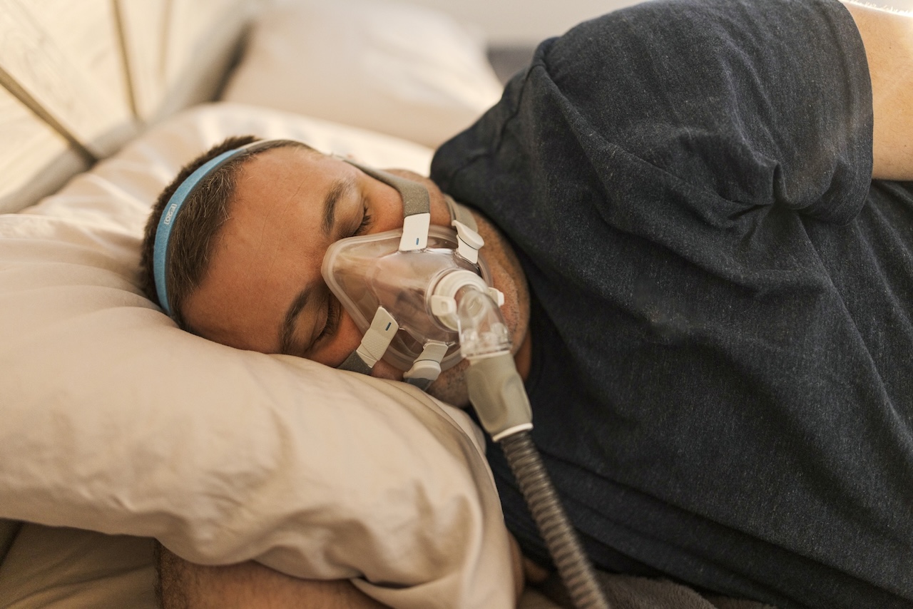 Man sleeping with CPAP