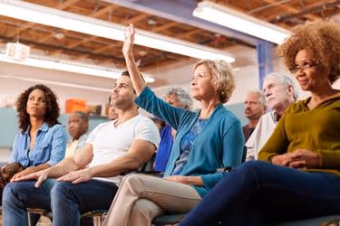 Woman giving feedback during an HOA Meeting