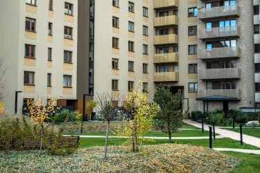 Apartment complex with trees and lots of leaves