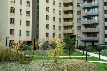 Apartment complex with trees and lots of leaves