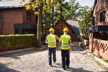Two inspectors checking an area