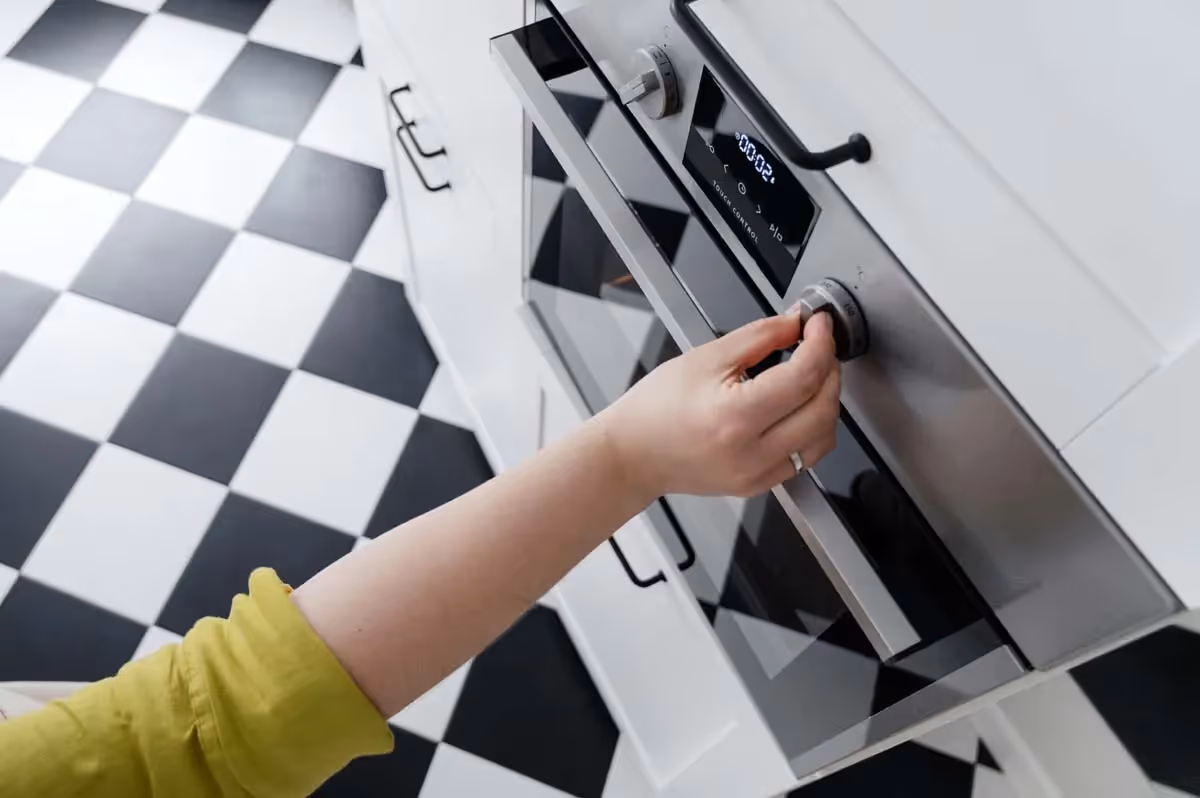 Featured Blog: A woman looking at a dishwasher