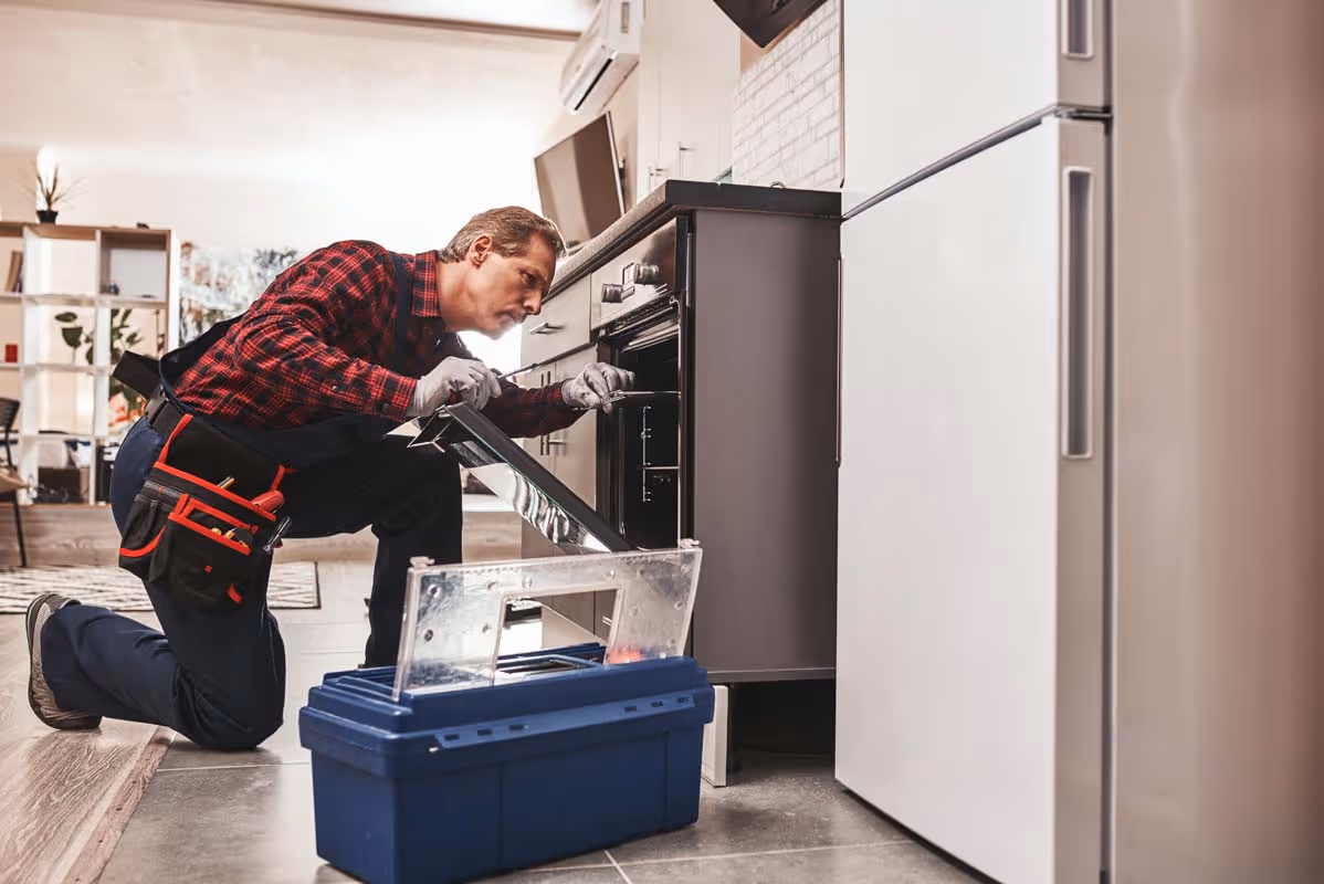 Featured Blog: A woman looking at a dishwasher