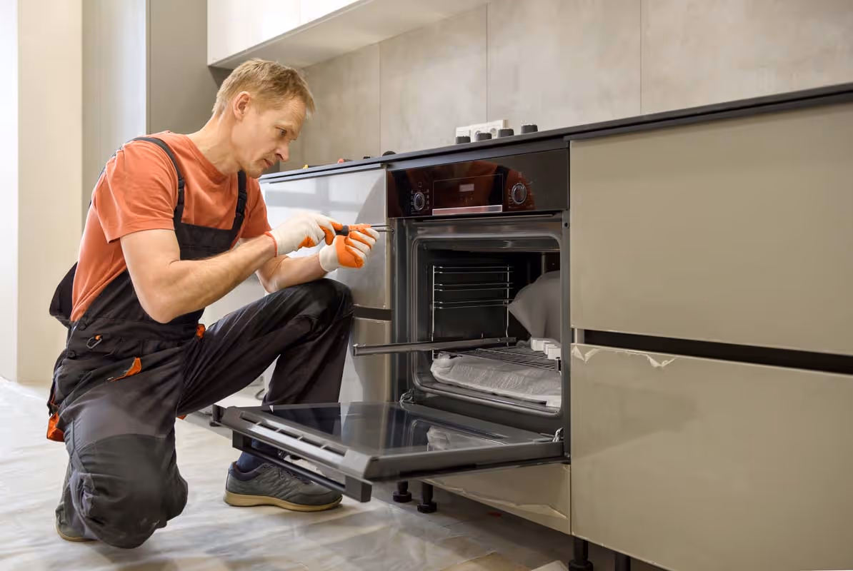 Featured Blog: A woman looking at a dishwasher