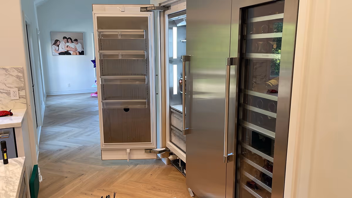 Featured Blog: A woman looking at a dishwasher