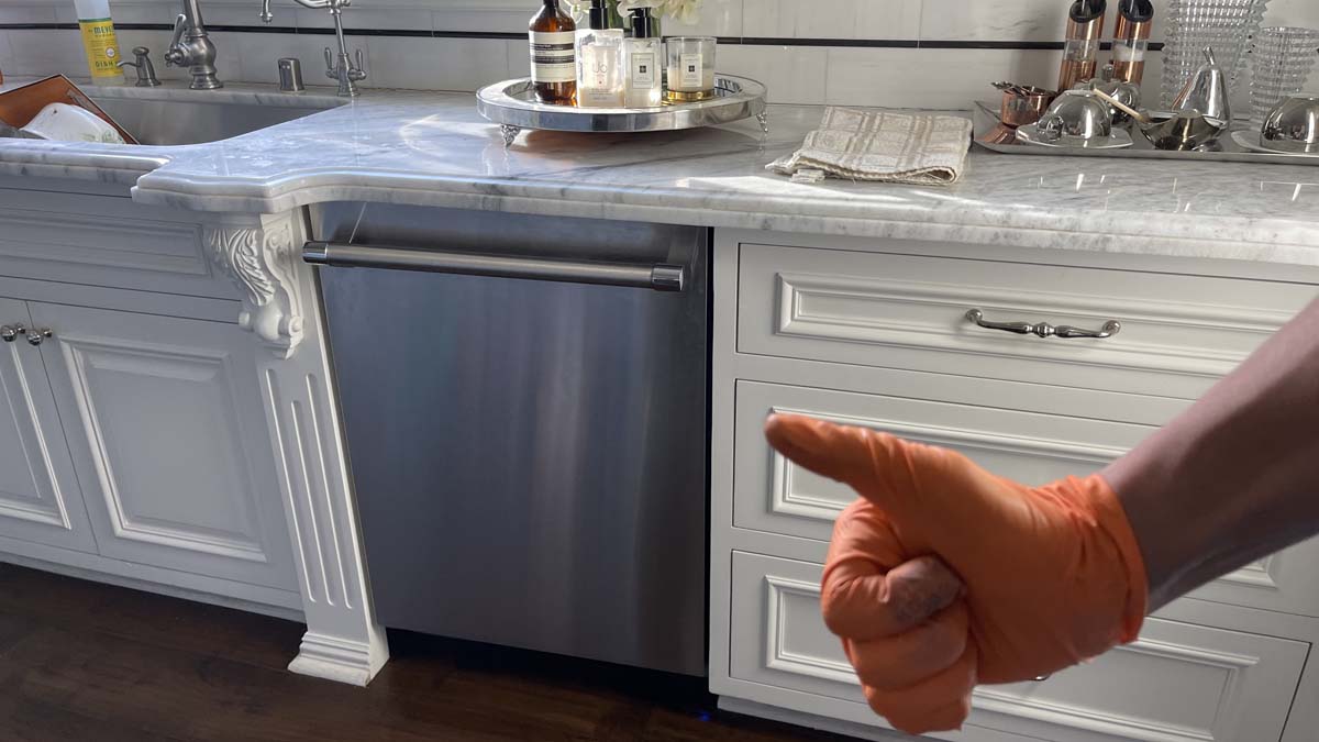 Featured Blog: A woman looking at a dishwasher