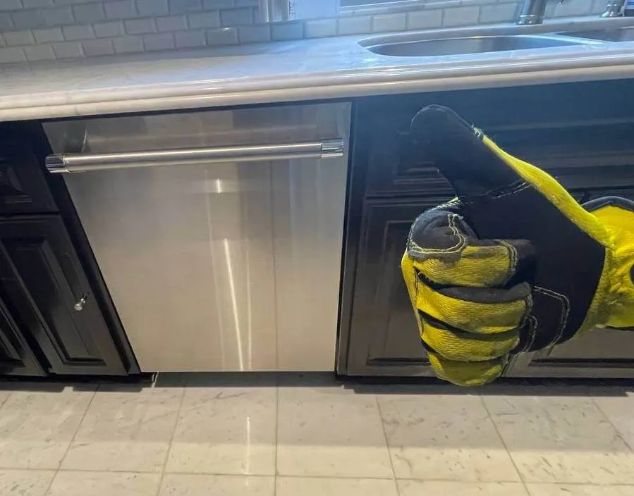 Commercial-style dishwasher with a thumbs-up in a modern kitchen – Best dishwasher repair specialists.