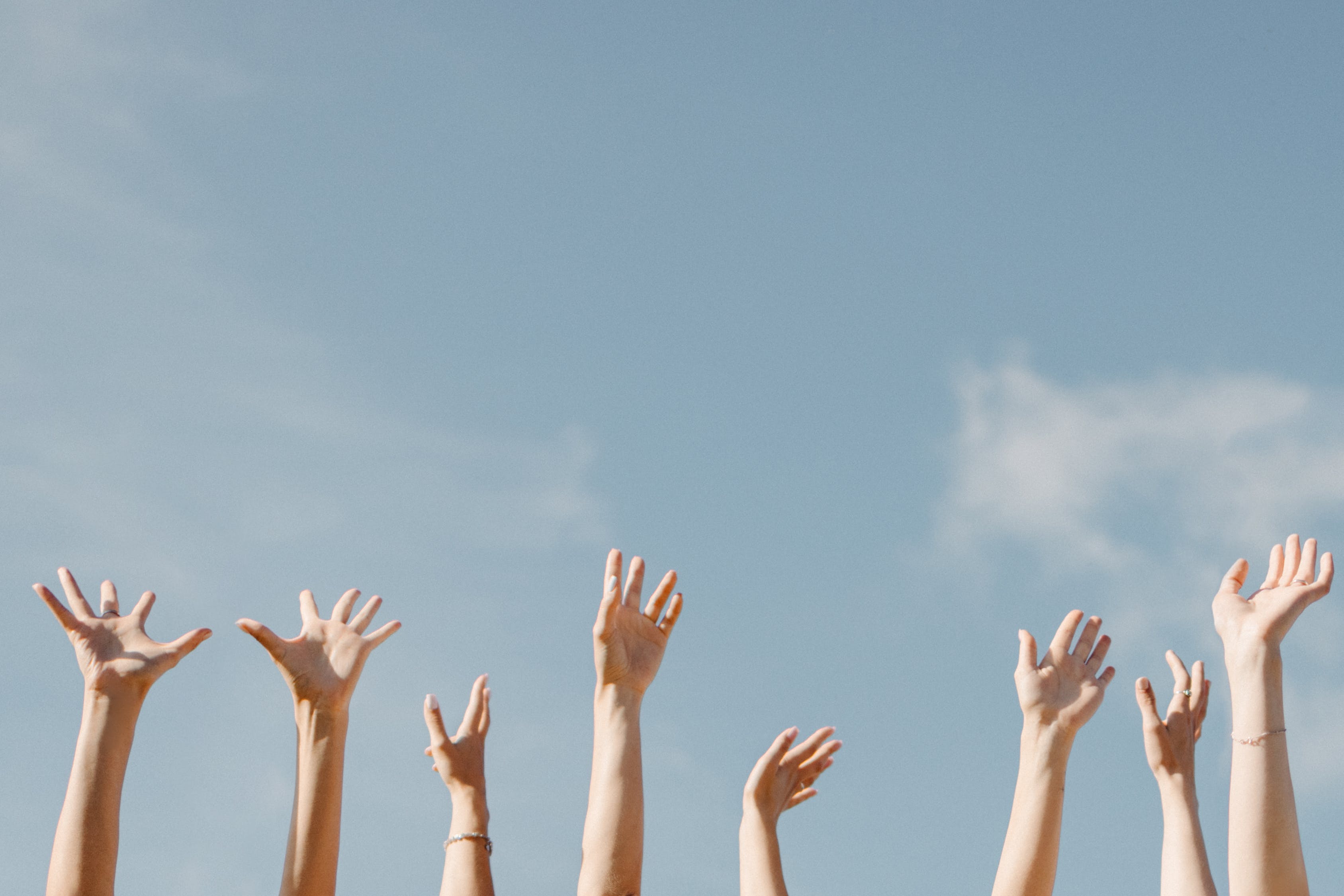 Hands raised to the sky