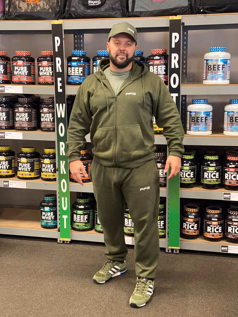 Customer wearing a green tracksuit