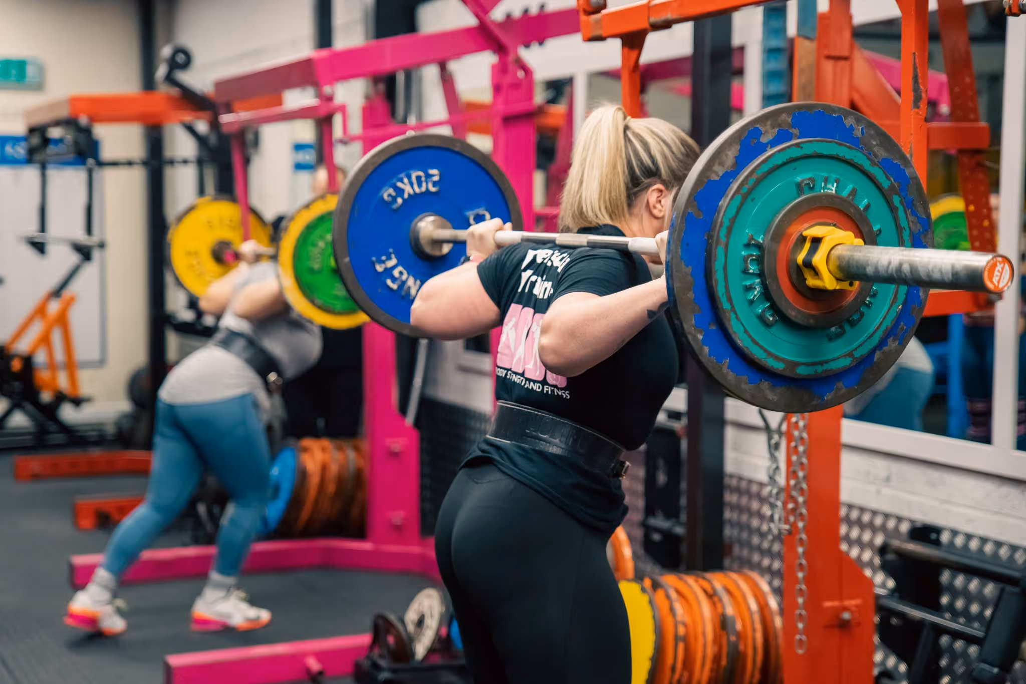 A woman lifting a large weight