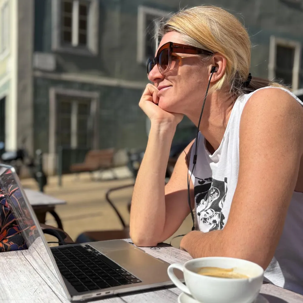 Eva contemplating a session in the sun on a terrace in Lisbon