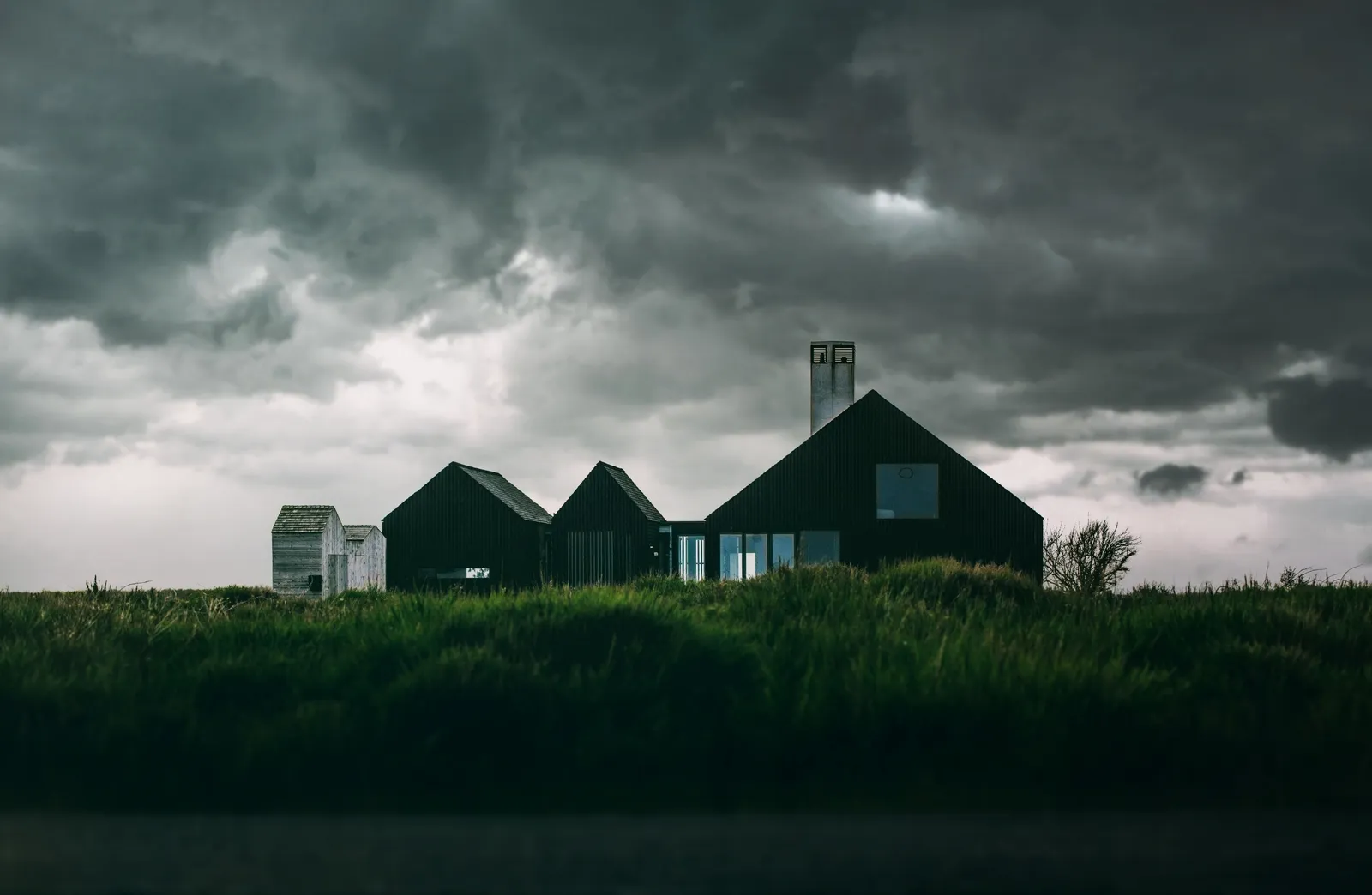 Storm clouds rolling over a row of houses