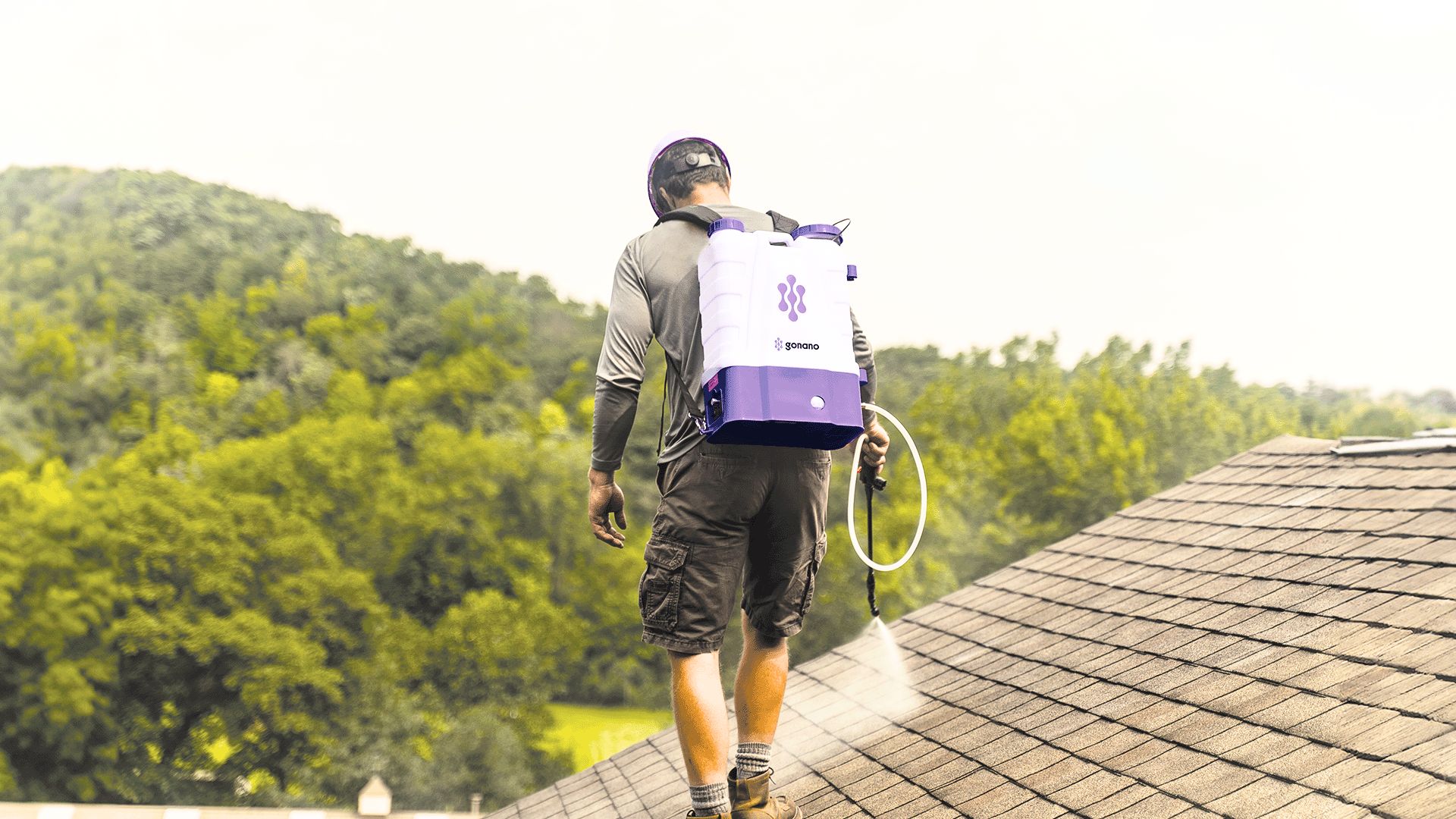 NuRoof Structural Roof Rejuvenation being spray-applied to an asphalt shingle roof