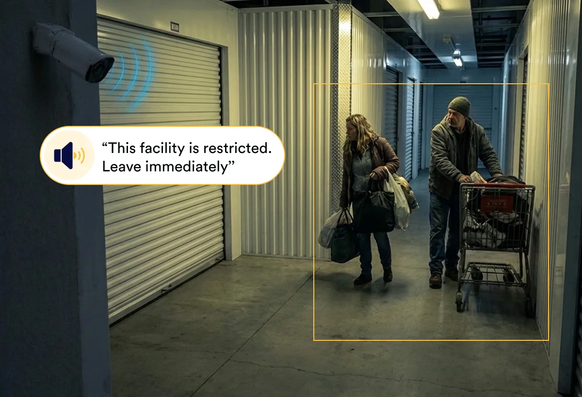 Security camera talkdown telling trespassers in a self-storage hallway to leave immediately