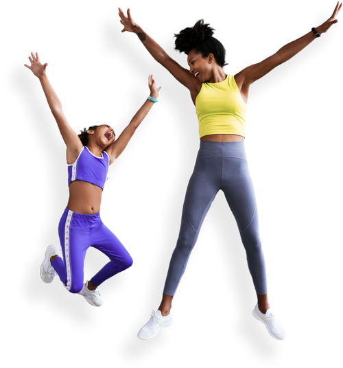 Mother and Daughter jumping up with their hands up in the air