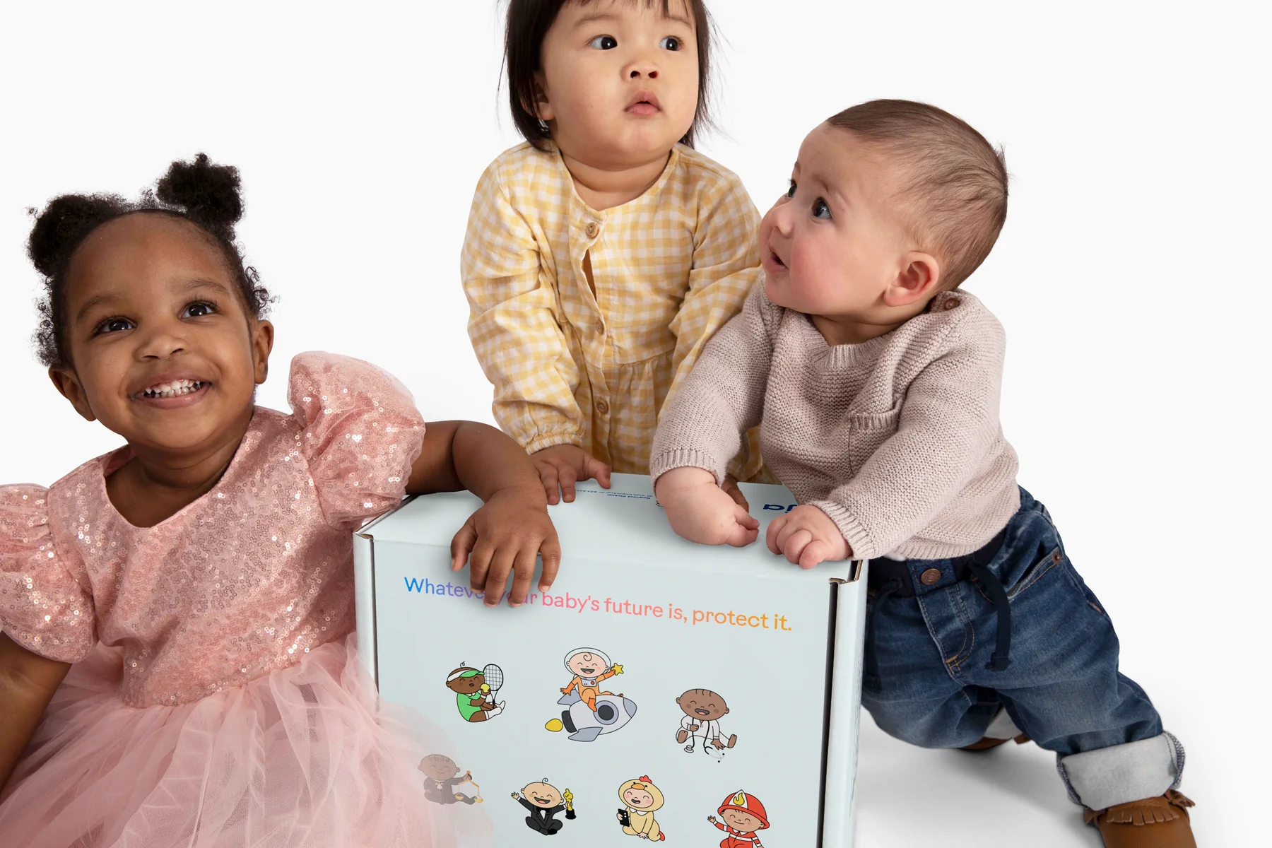 Three babies gathered around an Anja Health collection kit box