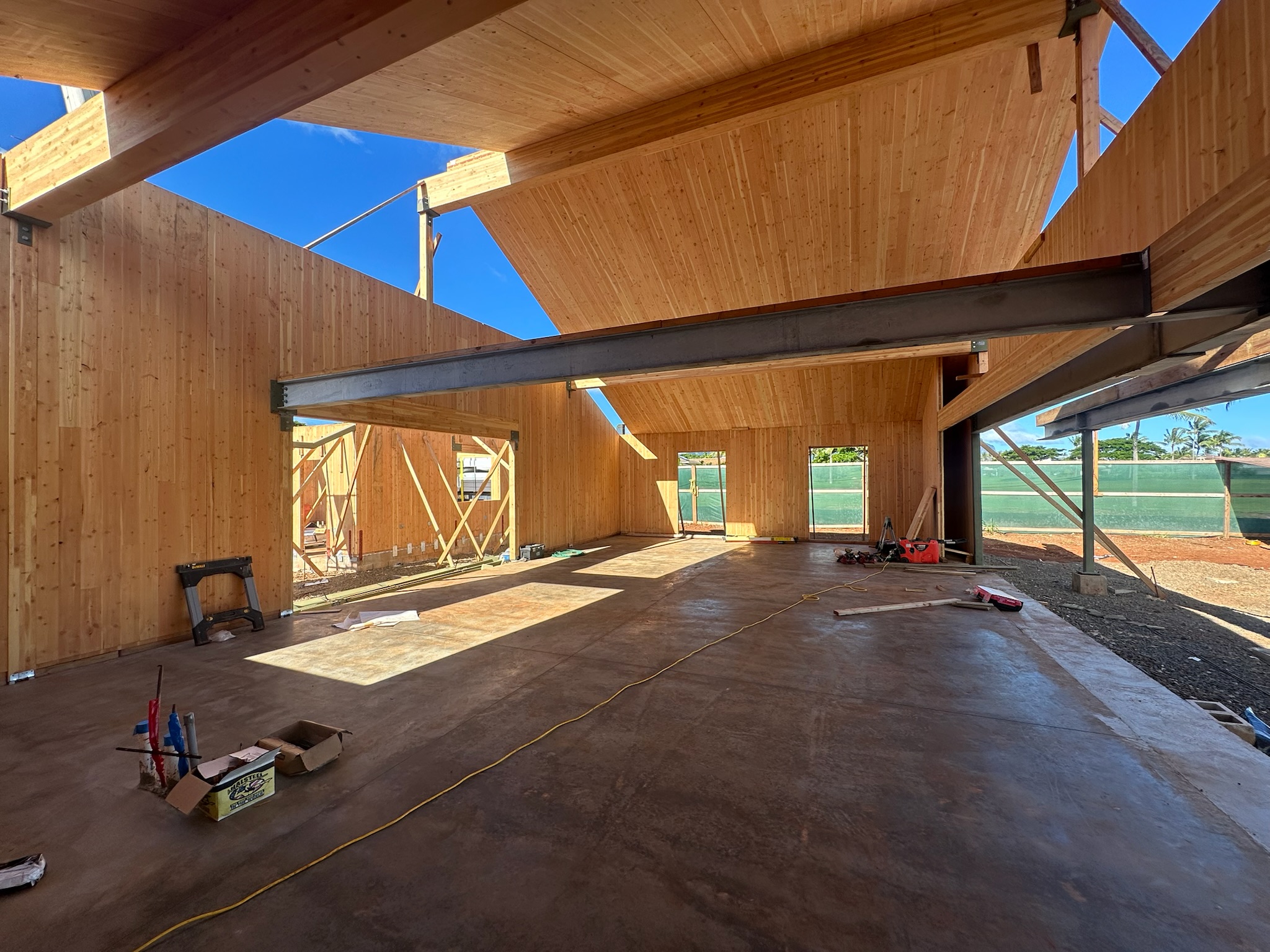 Interior view of exposed wood walls and steel beam
