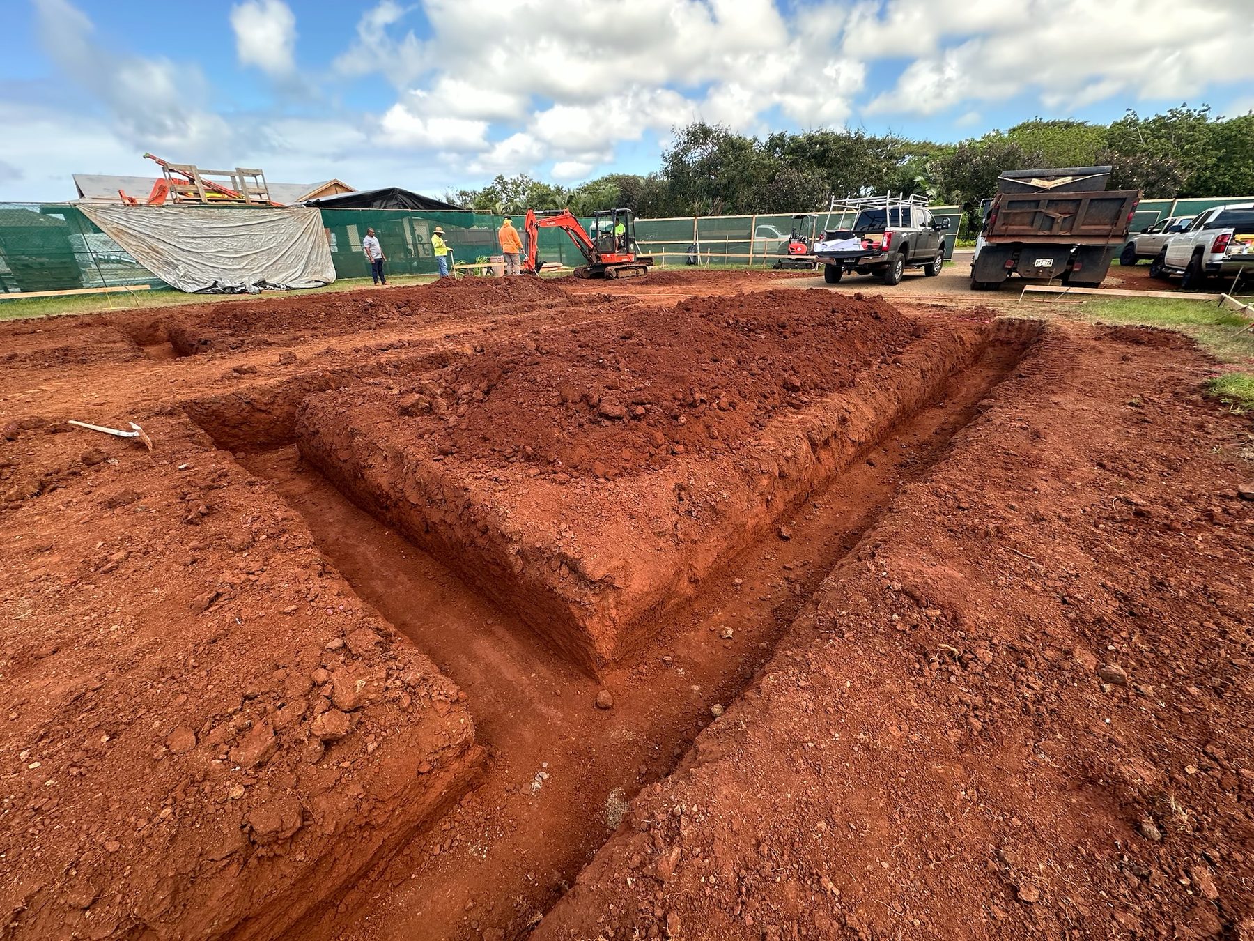 Footing trenches dug into red earth