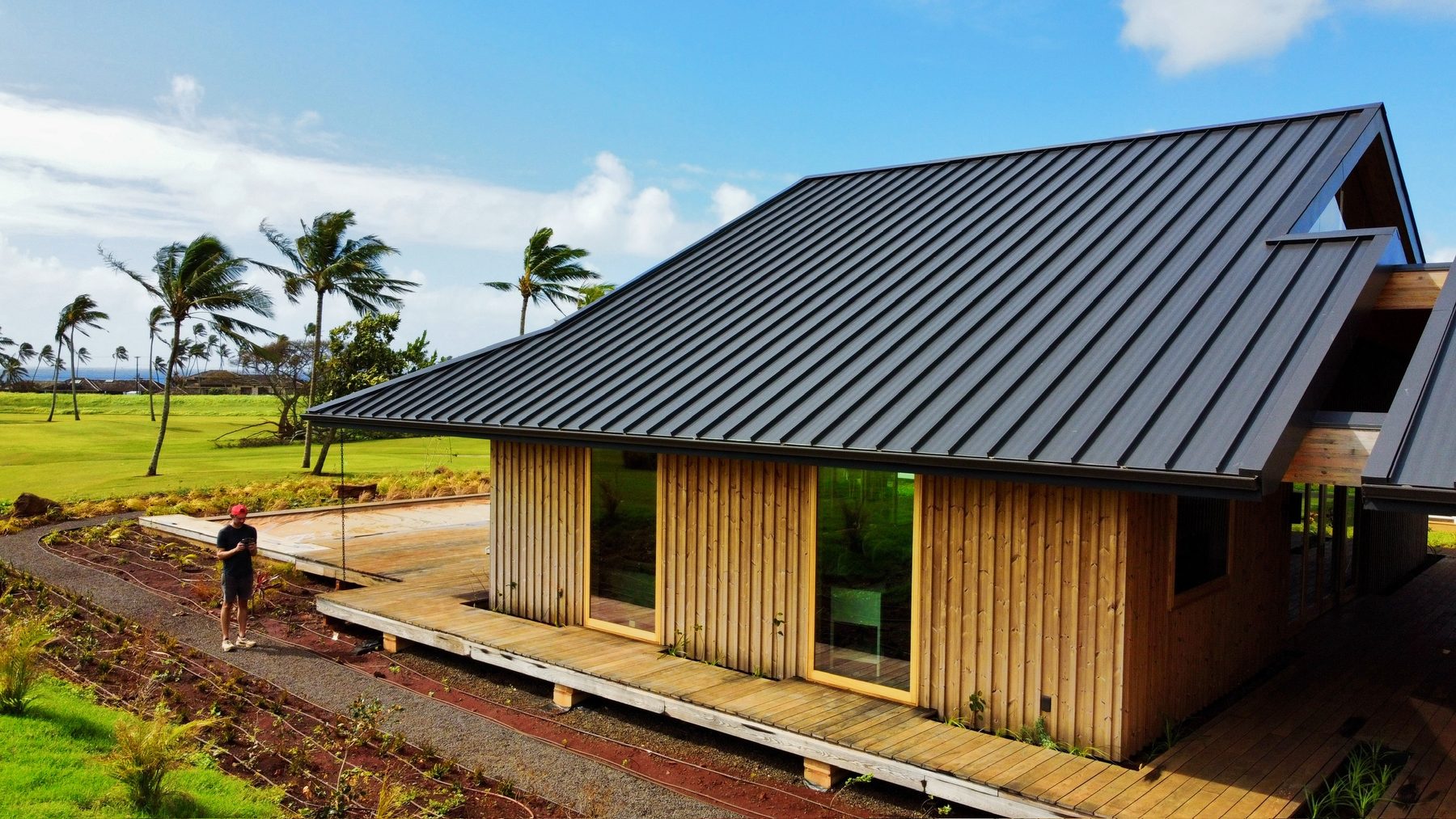 Standing-seam metal roof and wraparound deck