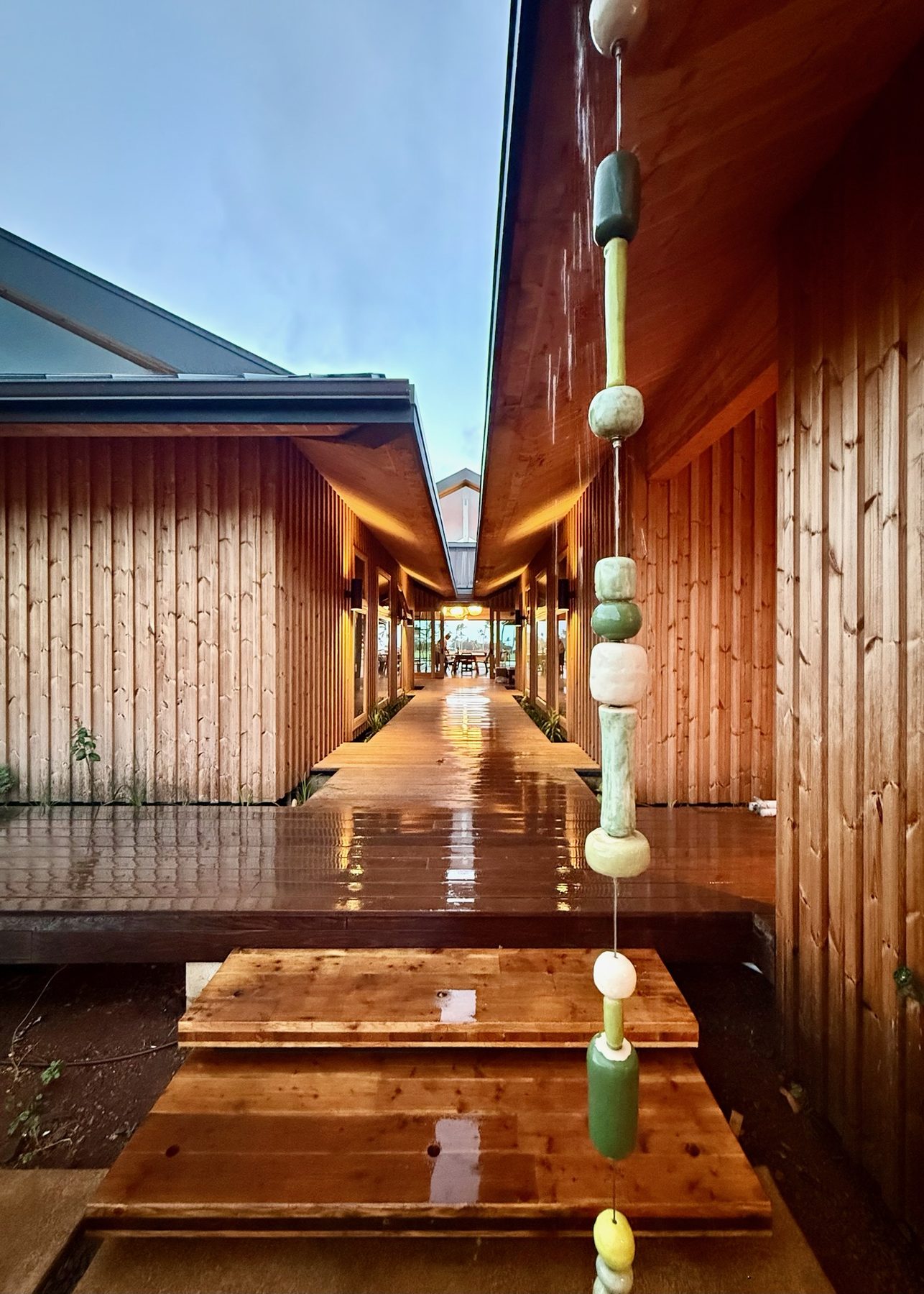 Ceramic rain chain beside the breezeway in the rain